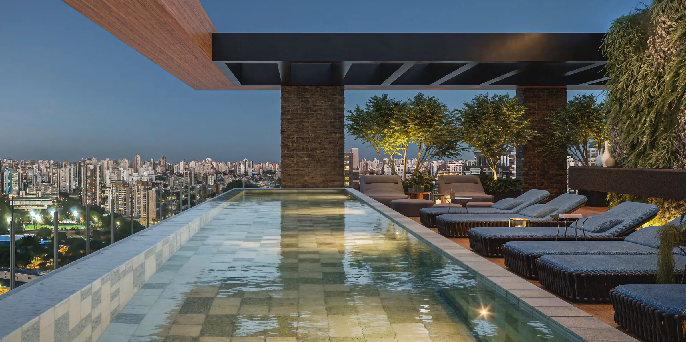 Piscina privativa com a cidade iluminada ao fundo